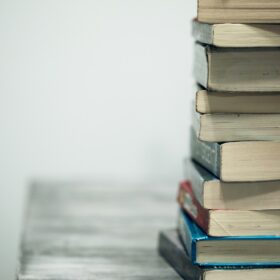 assorted books on wooden table